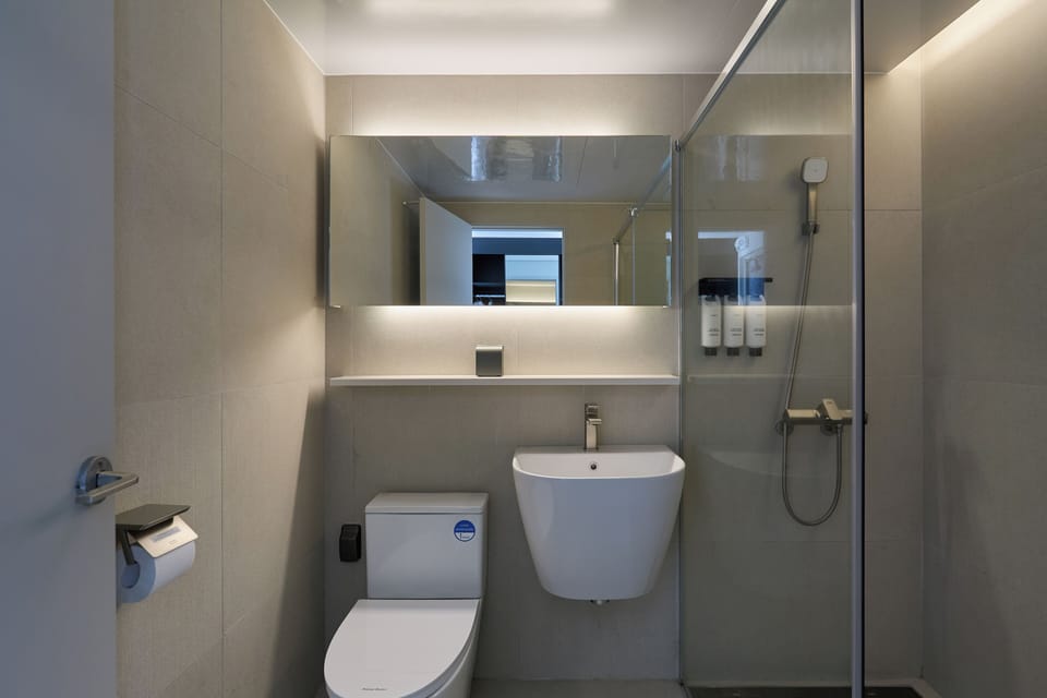 Shower, hair dryer, towels, shampoo