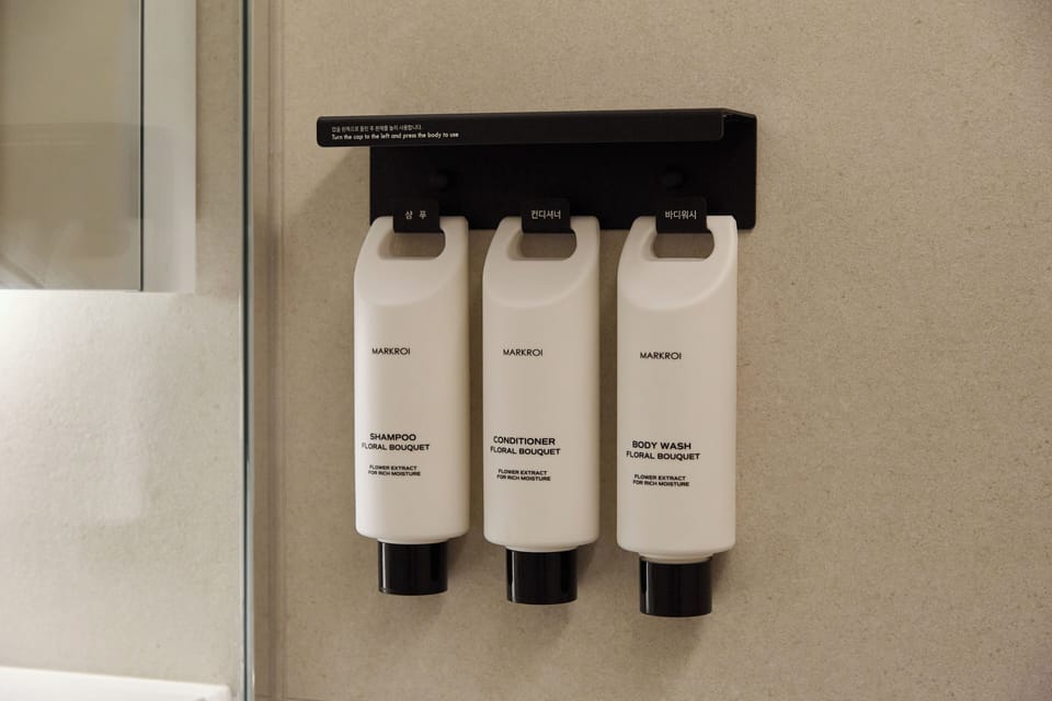 Shower, hair dryer, towels, shampoo