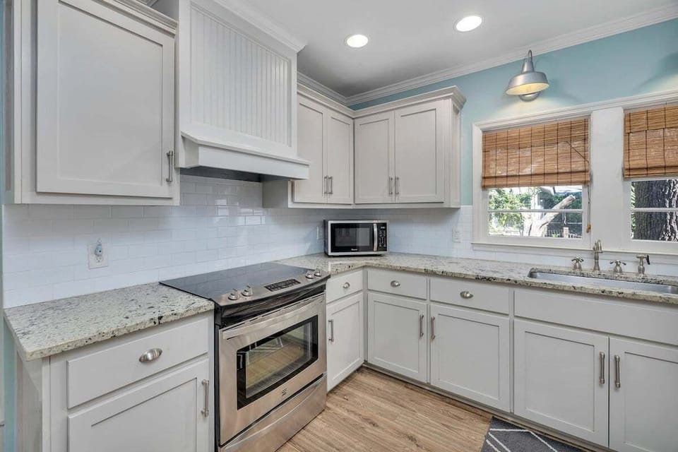 Kitchen with white cabinets and stainless steel appliances