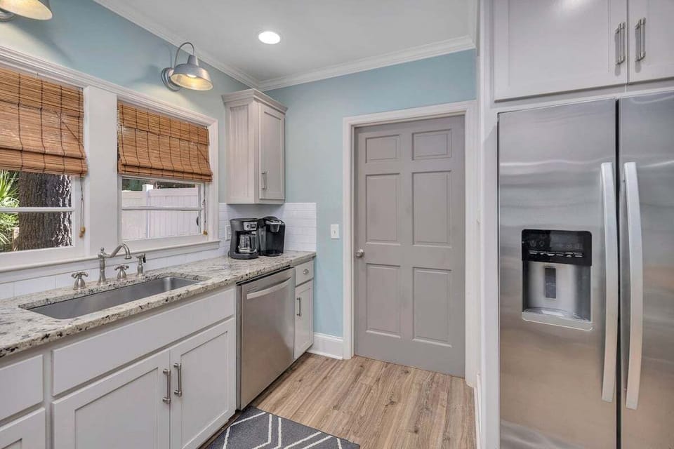 Kitchen with white cabinets and stainless appliances