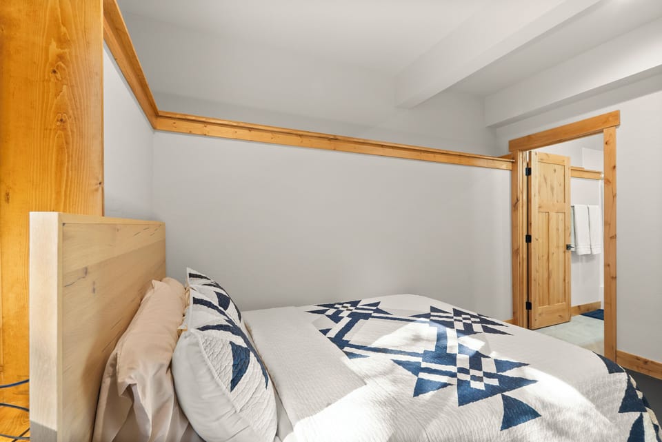 Ensuite room #3 with a queen bedroom and Peloton bike.