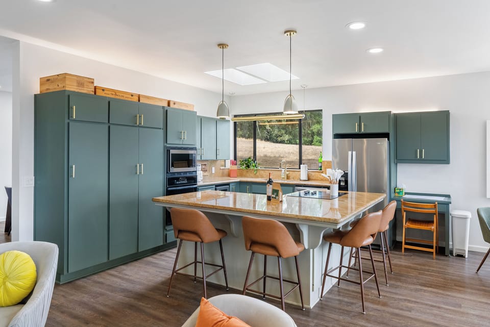 A beautifully designed, fully equipped kitchen with a spacious island, perfect for cooking, conversation, and making mealtime memories together.
