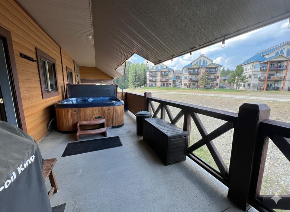 Private deck, with hot tub, seating and Gas BBQ. Overlooks the Owl T Bar and views across to the Rockies.