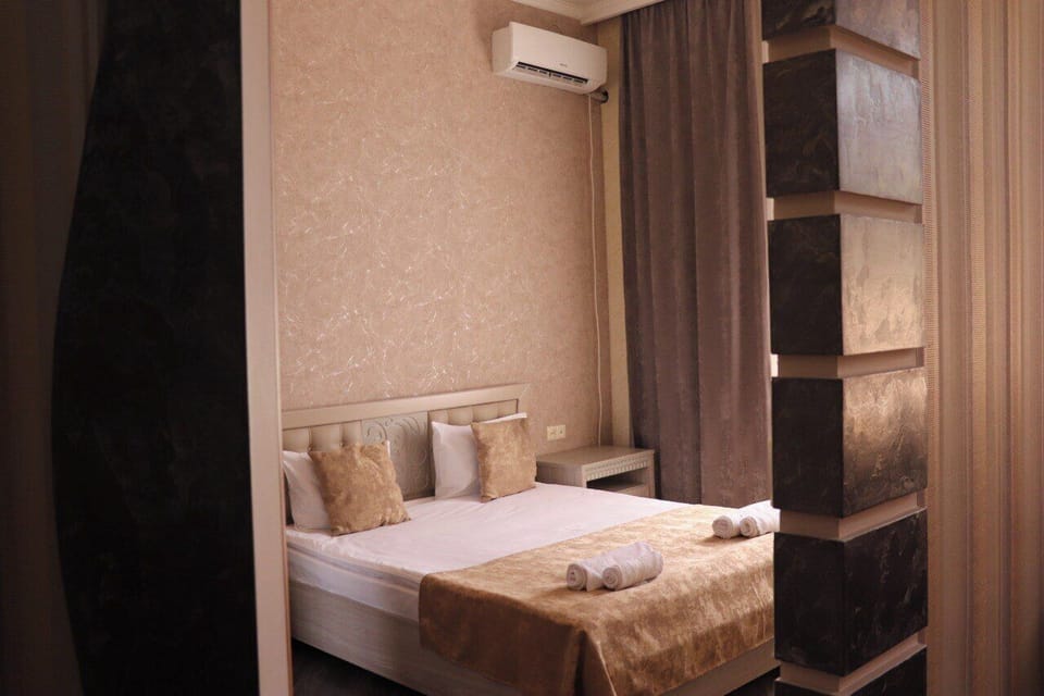 Deluxe Double Room, Courtyard View | Desk, laptop workspace, soundproofing, iron/ironing board