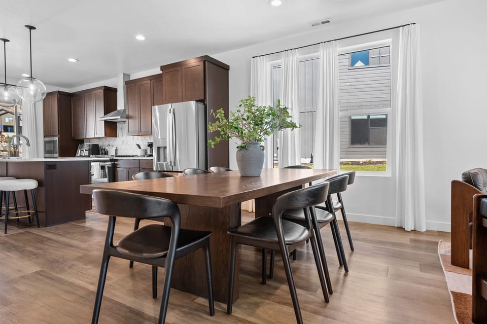 The spacious dining table for 8 is perfect for gathering with family and friends