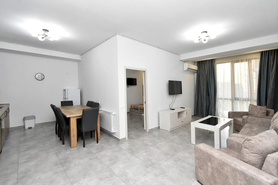 Basic Apartment | Living area | 50-inch flat-screen TV with cable channels