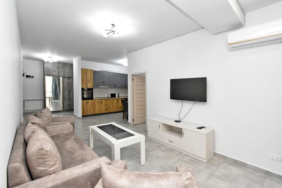 Basic Apartment | Living area | 50-inch flat-screen TV with cable channels