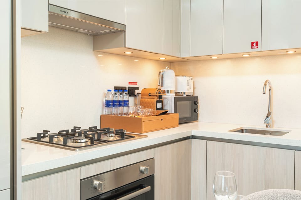 Design Apartment, Balcony, City View | Private kitchenette | Full-size fridge, microwave, oven, stovetop