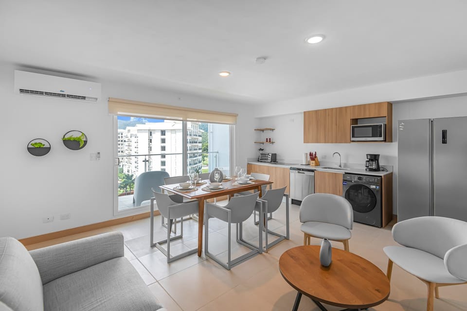 Lounge with Dining Area: A warm and inviting lounge that flows seamlessly into the dining space. Perfect for both relaxation and shared meals, this area offers comfortable seating and a spacious table to enjoy time together.