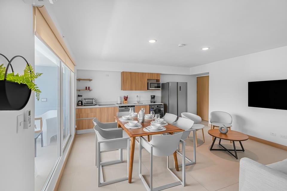 Lounge with Dining Area: A warm and inviting lounge that flows seamlessly into the dining space. Perfect for both relaxation and shared meals, this area offers comfortable seating and a spacious table to enjoy time together.