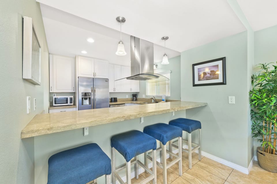 Bar seating for conversations while meals are being prepped.