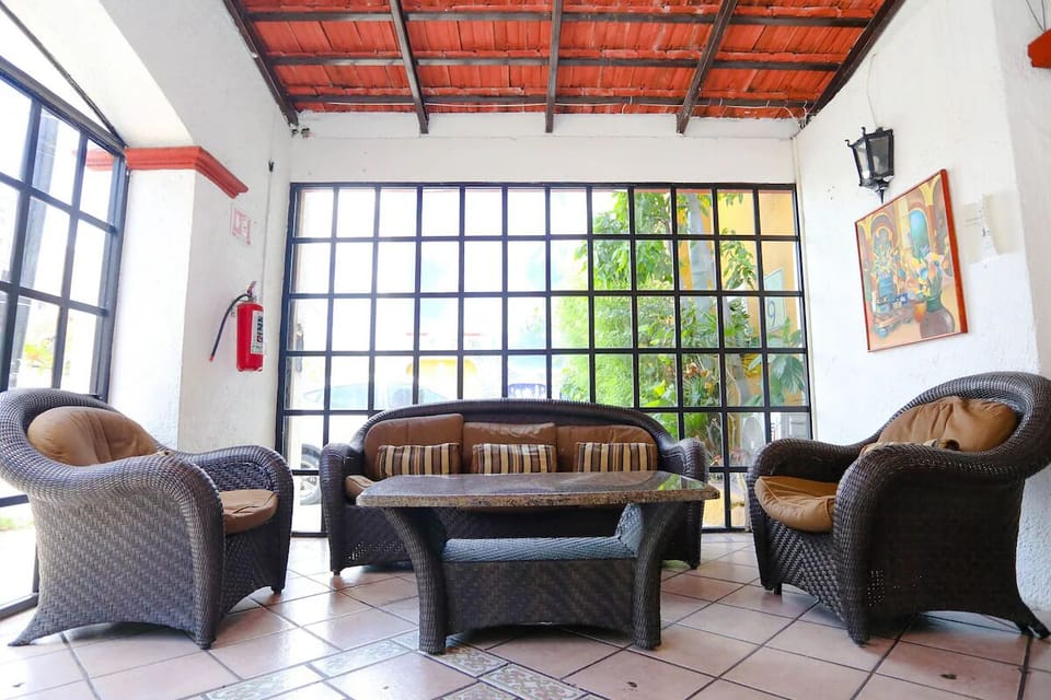 Unwind in the airy lounge with cozy wicker seating.