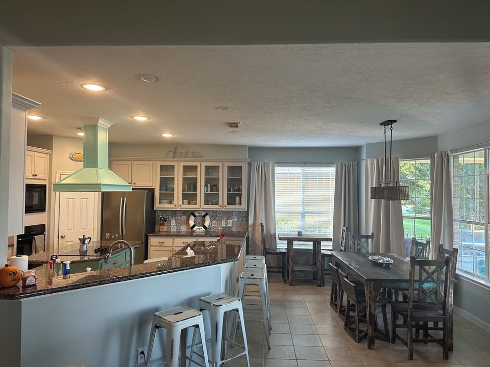 Open concept living space with kitchen, dining room and living room.