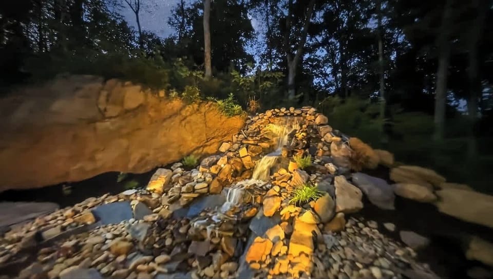 Enjoy the soothing sounds of the powerful waterfall by the Patio.