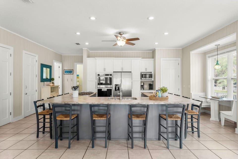 Wrap around kitchen island with seating for 12 