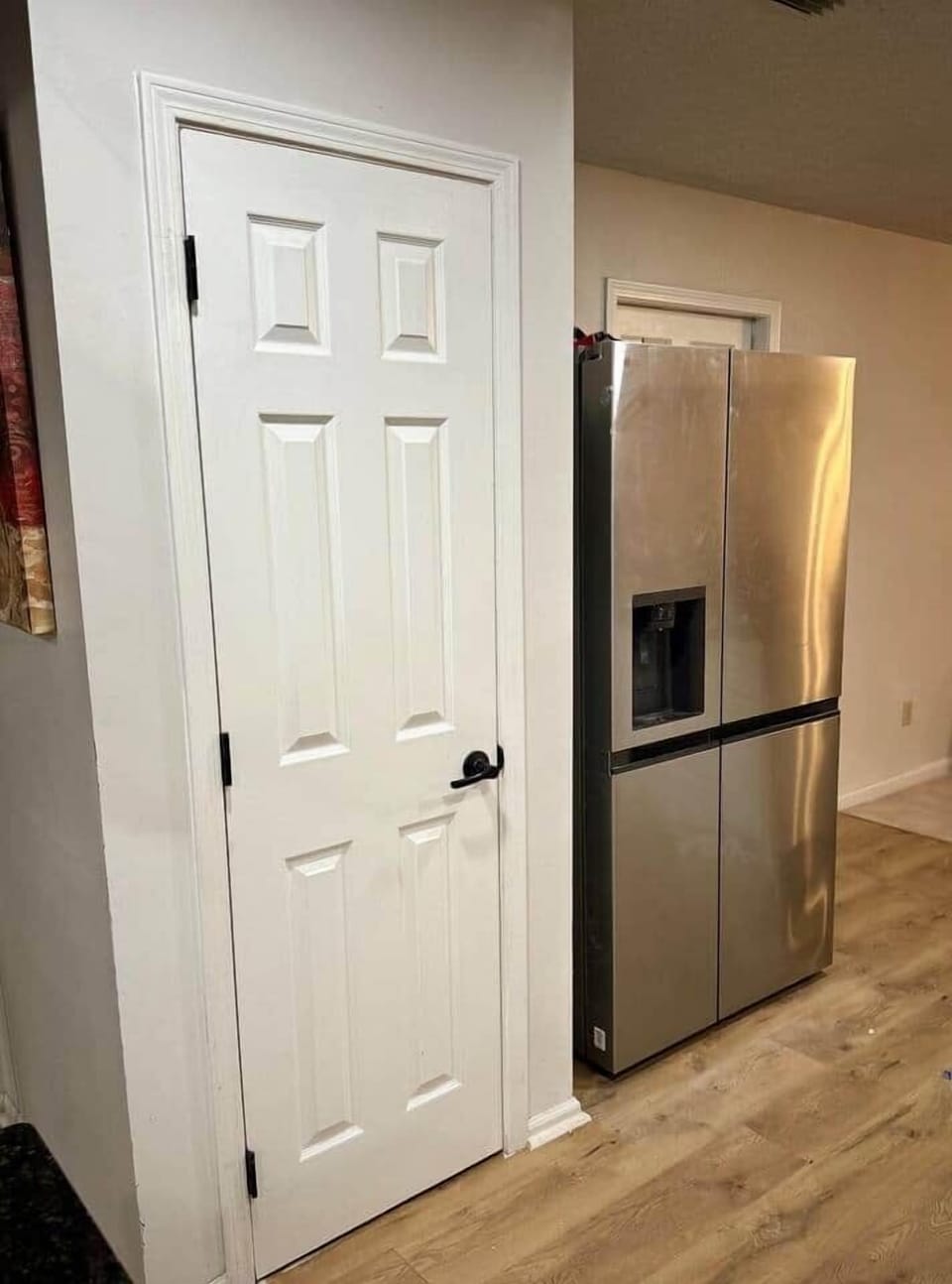 Refrigerator and large pantry located in the kitchen