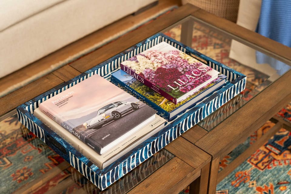 Cozy up in the living room and flip through art and design books that add to the home's charm.