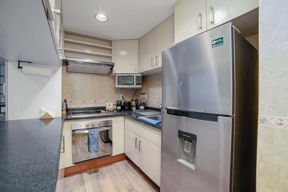 Full size kitchen with Nespresso machine (Complimentary coffee pods included) wine glasses, pots and pans
