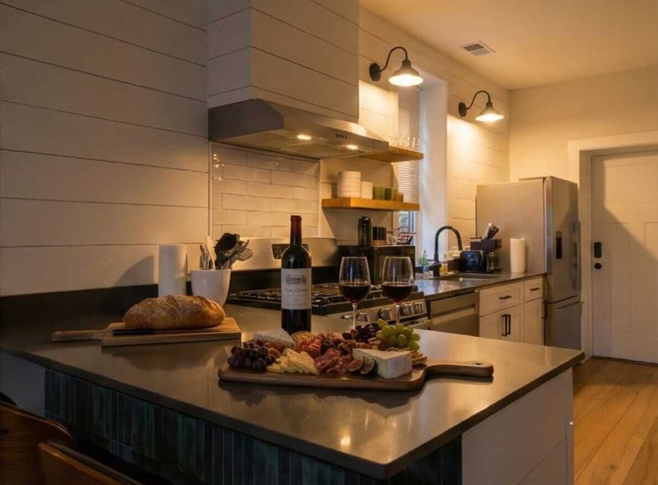Wine and dine in. Our kitchen island is perfect for evening tapas and a glass of red before heading out for the night.