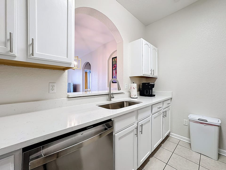 Kitchen includes many modern amenities, all stainless steel appliances, quartz 