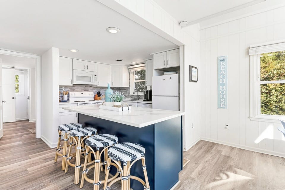 The fully equipped kitchen offers everything you need for vacation cooking, with a convenient counter bar for casual dining or meal prep.
