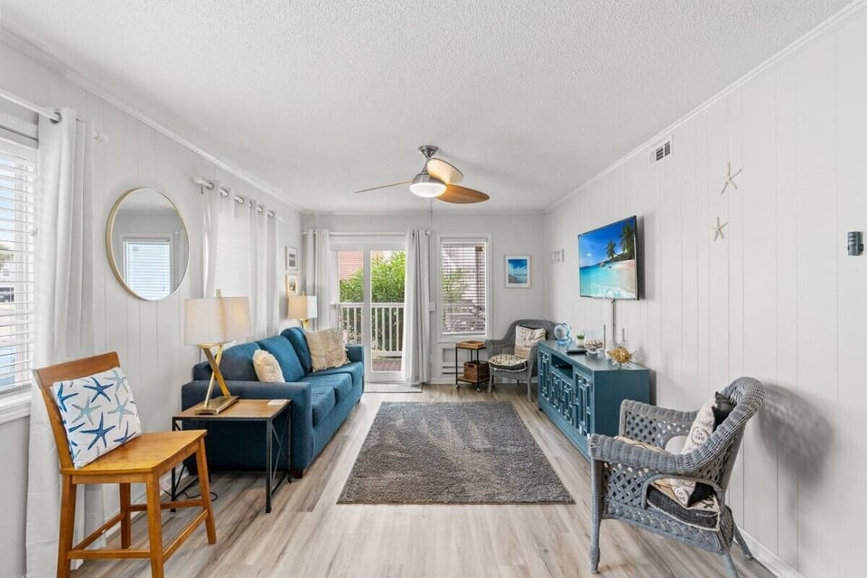 Living room, corner unit with natural light.
