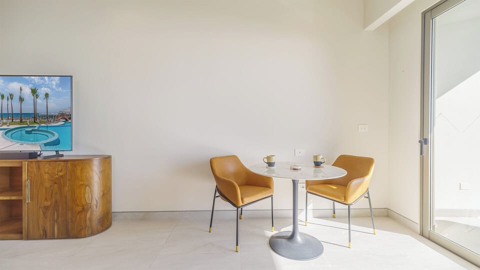 A cafe table lets two sit and enjoy coffee with a view!