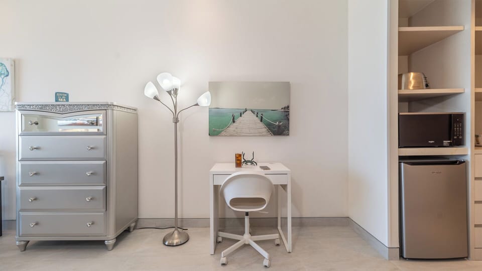 Writing desk, fridge and microwave