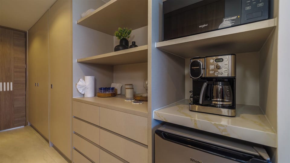 kitchenette coffee maker, microwave, and refrigerator