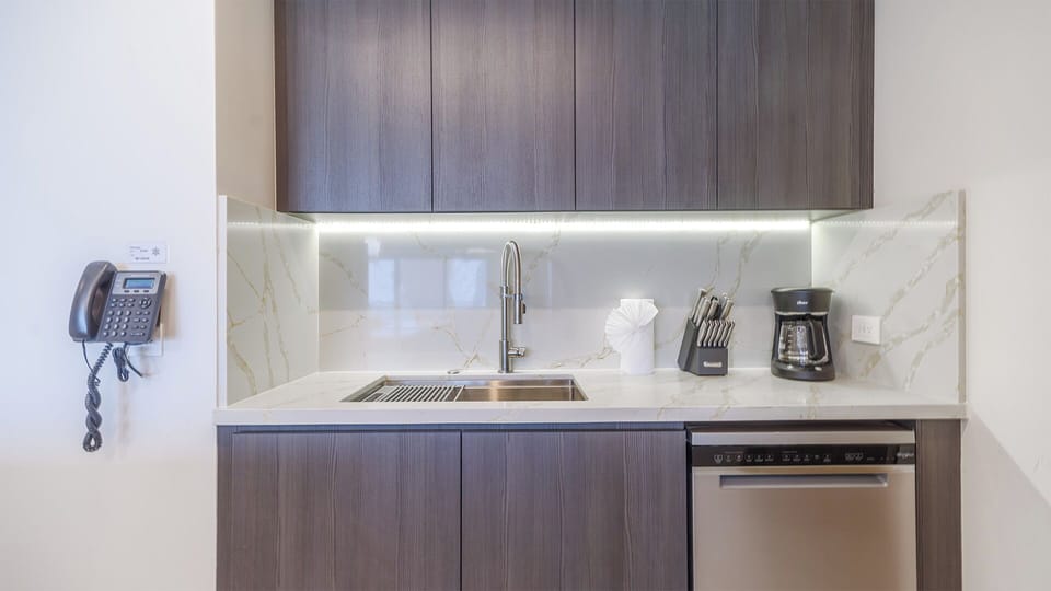 Generous sink and prep area with ample counter space for culinary convenience.