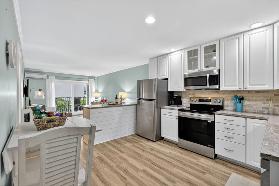 The open floor plan seamlessly connects the kitchen, dining, and living space!
