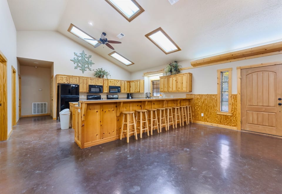 Inside, the open kitchen and dining area create a welcoming atmosphere for shared meals and conversation.