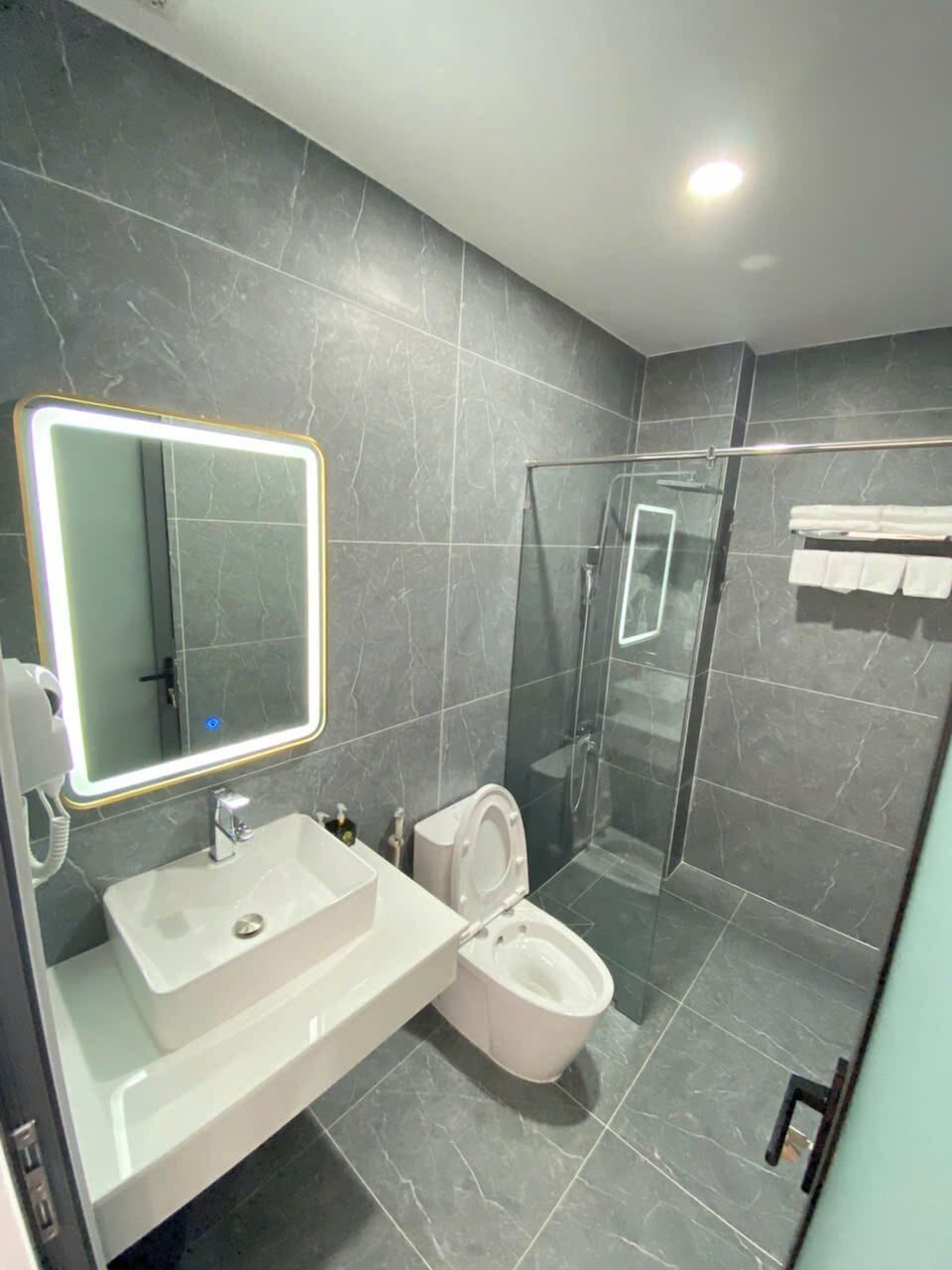 Shower, free toiletries, hair dryer, slippers