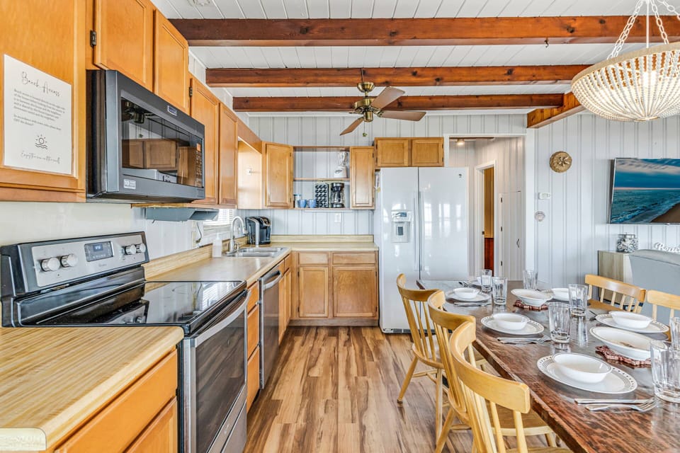 The kitchen in the upper level is well-equipped with appliances and everything you need for easy meal preparation. Drip coffee maker is also available