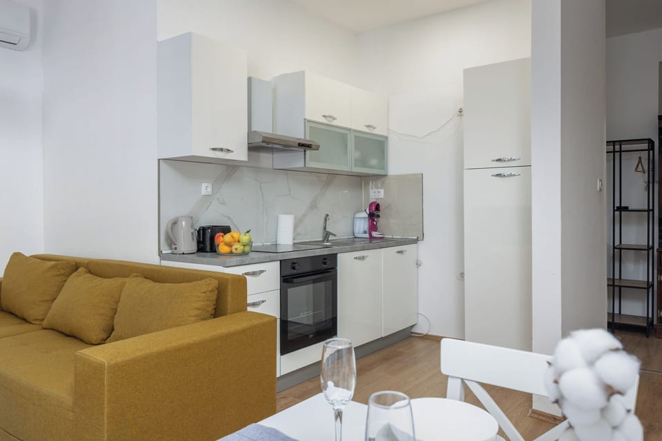Standard Apartment, 4 Bedrooms, Balcony (Anna | 4-Bedroom City Apartment) | Living area | Flat-screen TV