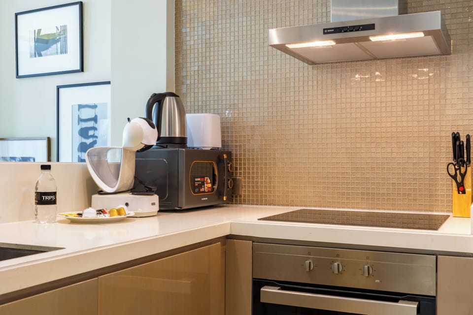 Deluxe Apartment, Balcony, City View | Private kitchen | Espresso maker, electric kettle