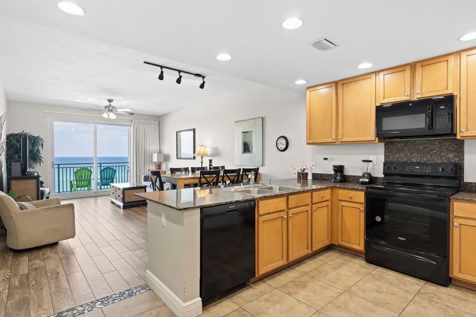 Unit 506: Open kitchen with modern appliances.