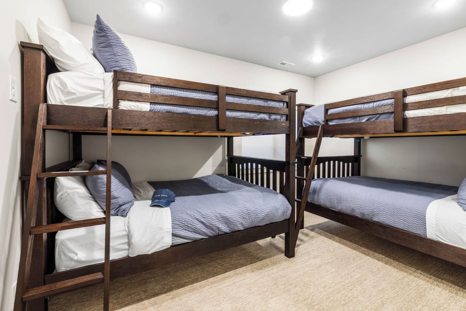 Bedroom 4 features 2 sets of twin bunk beds and an ensuite bathroom.
