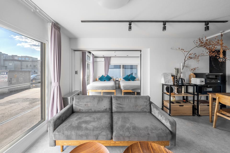 Apartment | Living room | 65-inch flat-screen TV with digital channels