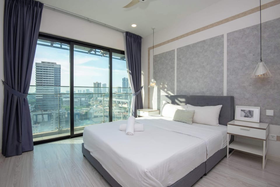 A master bedroom with a queen sized bed and an en-suite.