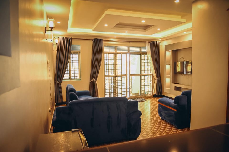 Comfort Apartment, Garden View | Living area | Flat-screen TV