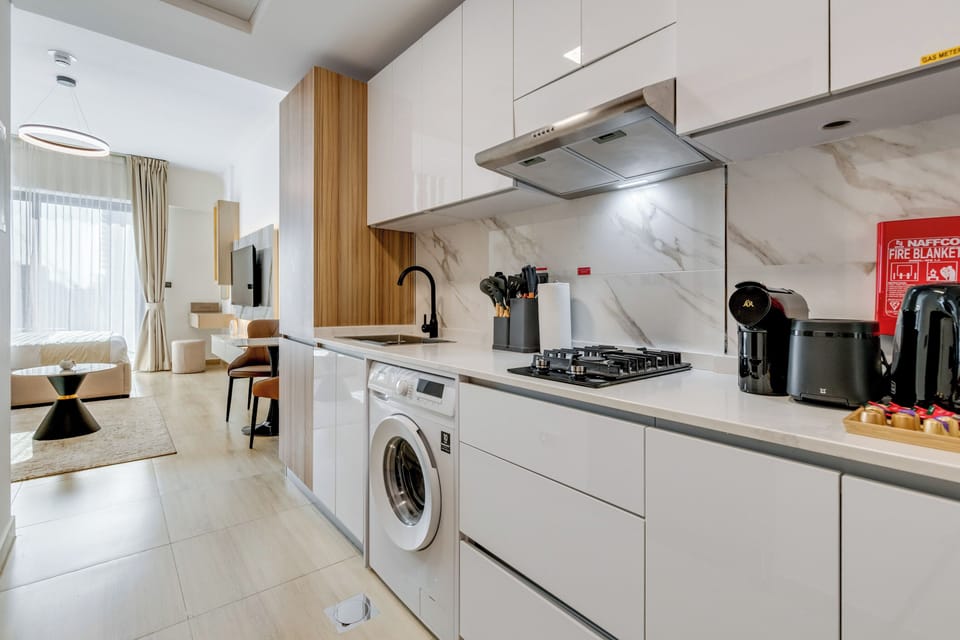 Deluxe Studio, 1 Queen Bed with Sofa bed, Balcony, City View | Private kitchen | Fridge, microwave, stovetop, coffee/tea maker