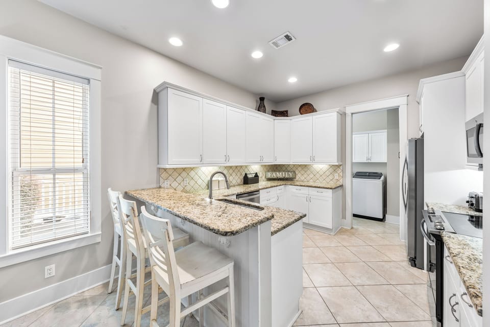 Fully equipped kitchen with countertop sitting