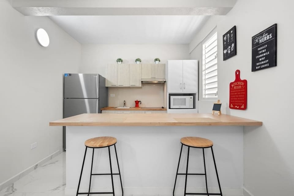Sleek wood counter and modern appliances. Cook like home!	