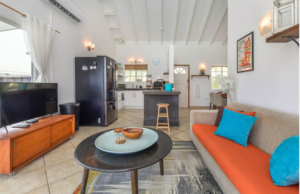 Convenient separate laundry space equipped with washer and dryer.