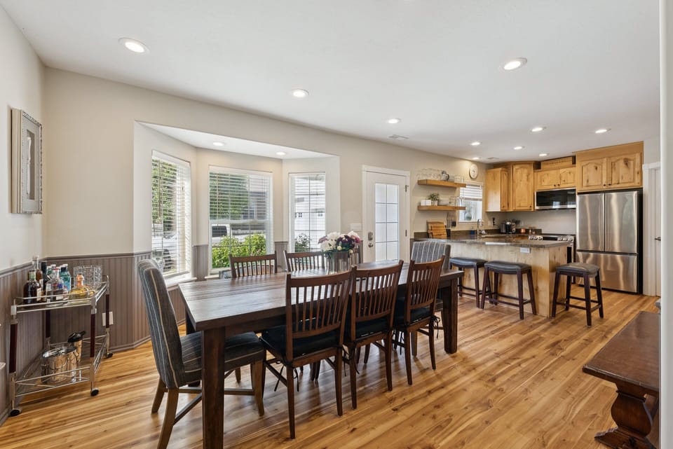 Dining Room with seating for 8 plus 4 bar stools at the kitchen counter