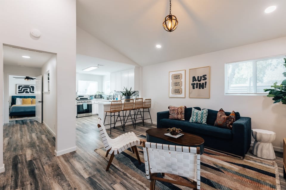 big hall way connected to the living room , leads to master bedroom