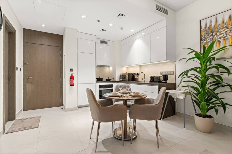 Bright, elegant space for dining and lounging, filled with natural light.