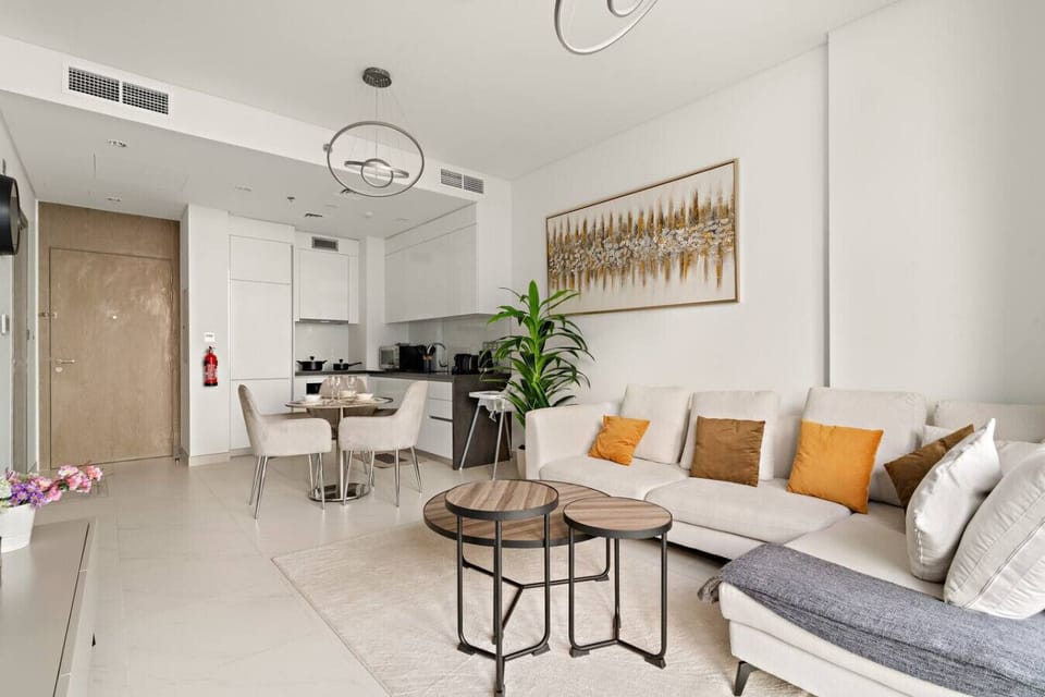 Clean white design with modern art and warm accent colors for comfort.