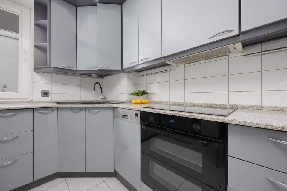 The corner cabinet layout provides plenty of storage space and convenience for meal preparation.